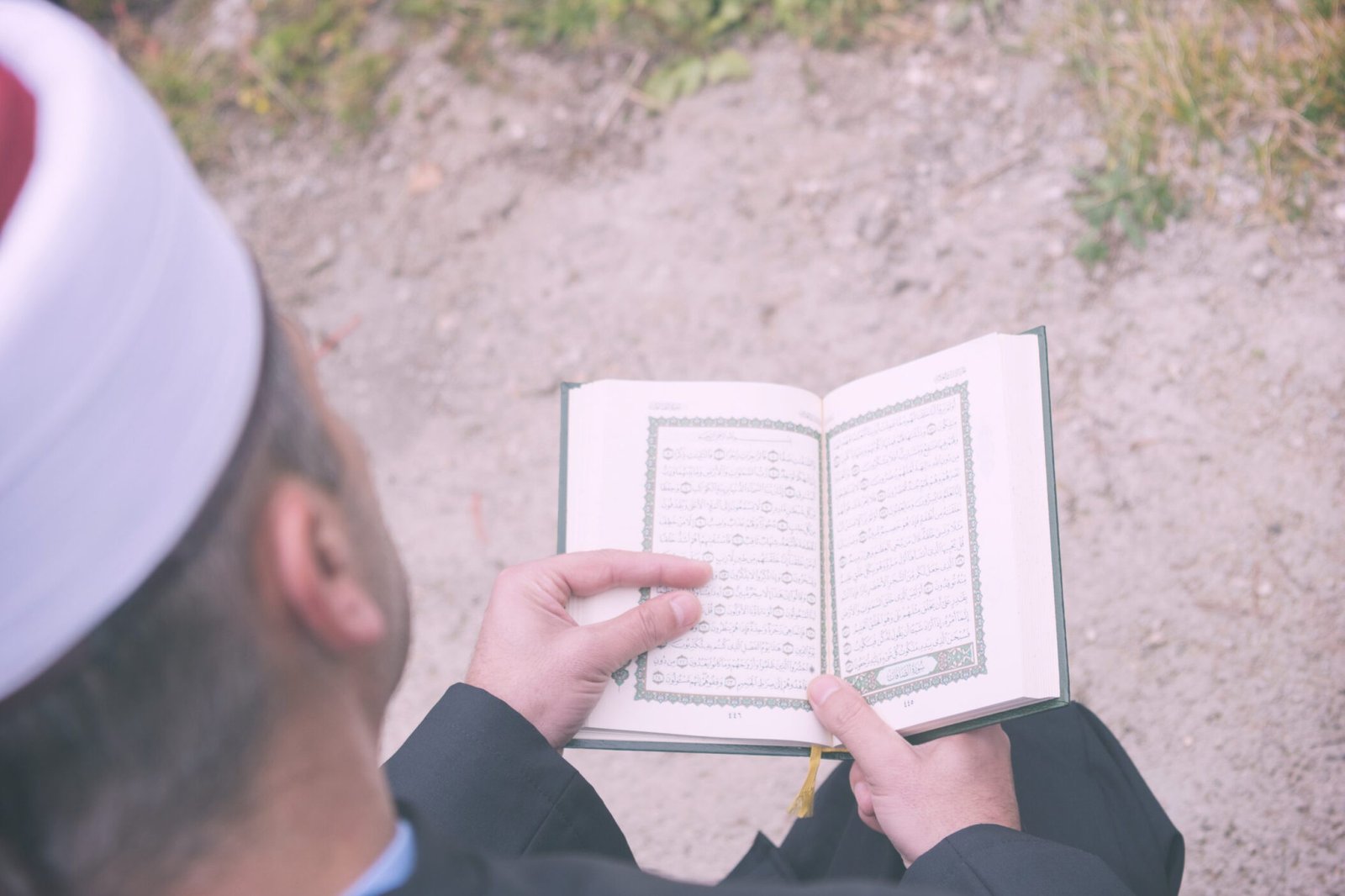 quran holy book reading by imam  on islamic funeral with white thumb stones graweyard background